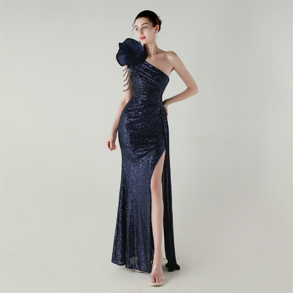 Purplish blue one-shoulder beaded evening gown with diagonal neckline and side slit fishtail hem