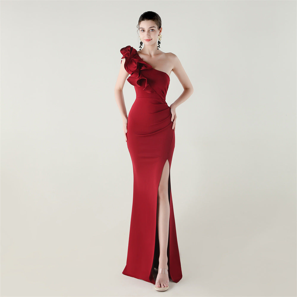 Red one-shoulder satin evening dress with layered ruffle shoulder and high slit
