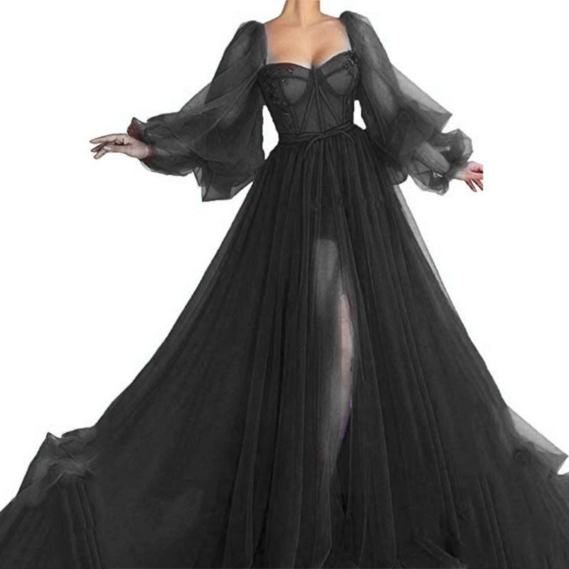 Black mesh corset-style maxi dress with sheer puff sleeves and front slit