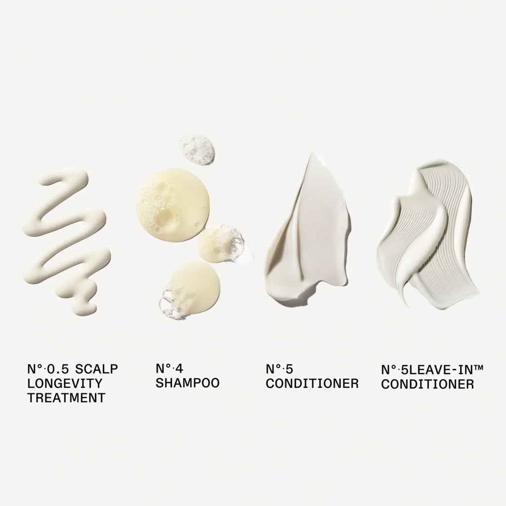 Hair care cleansing set bottles and leave-in tubes in a lineup