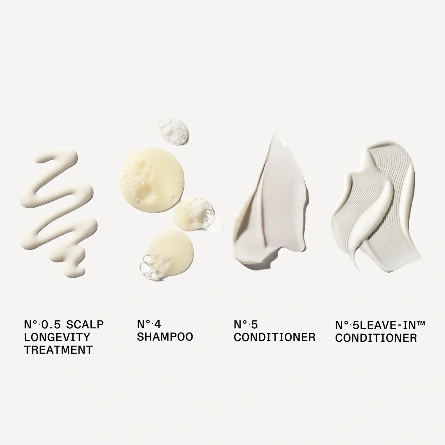 Hair care cleansing set bottles and leave-in tubes in a lineup