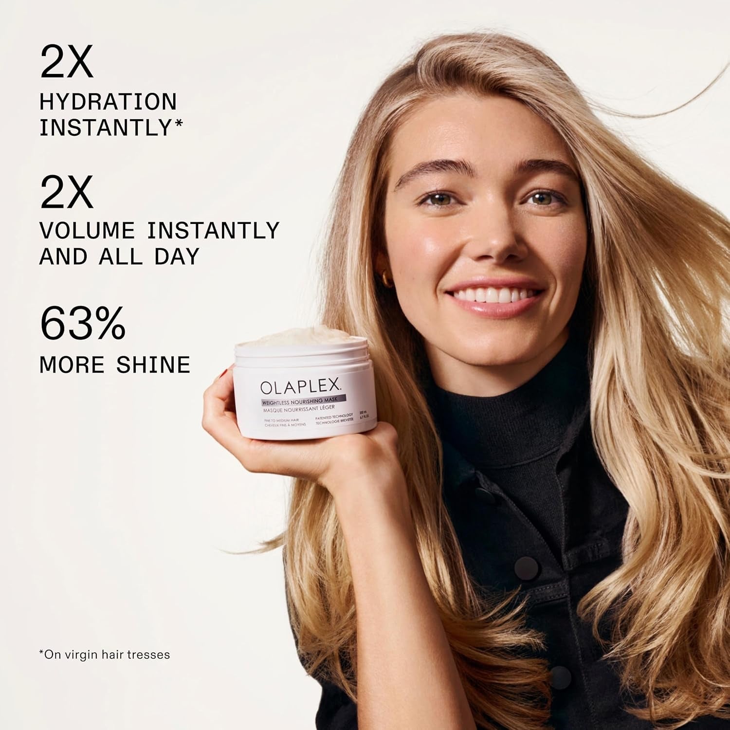 Olaplex Weightless Nourishing Mask jar held by smiling woman, cream label