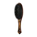 Oribe flat hair brush with black bristles