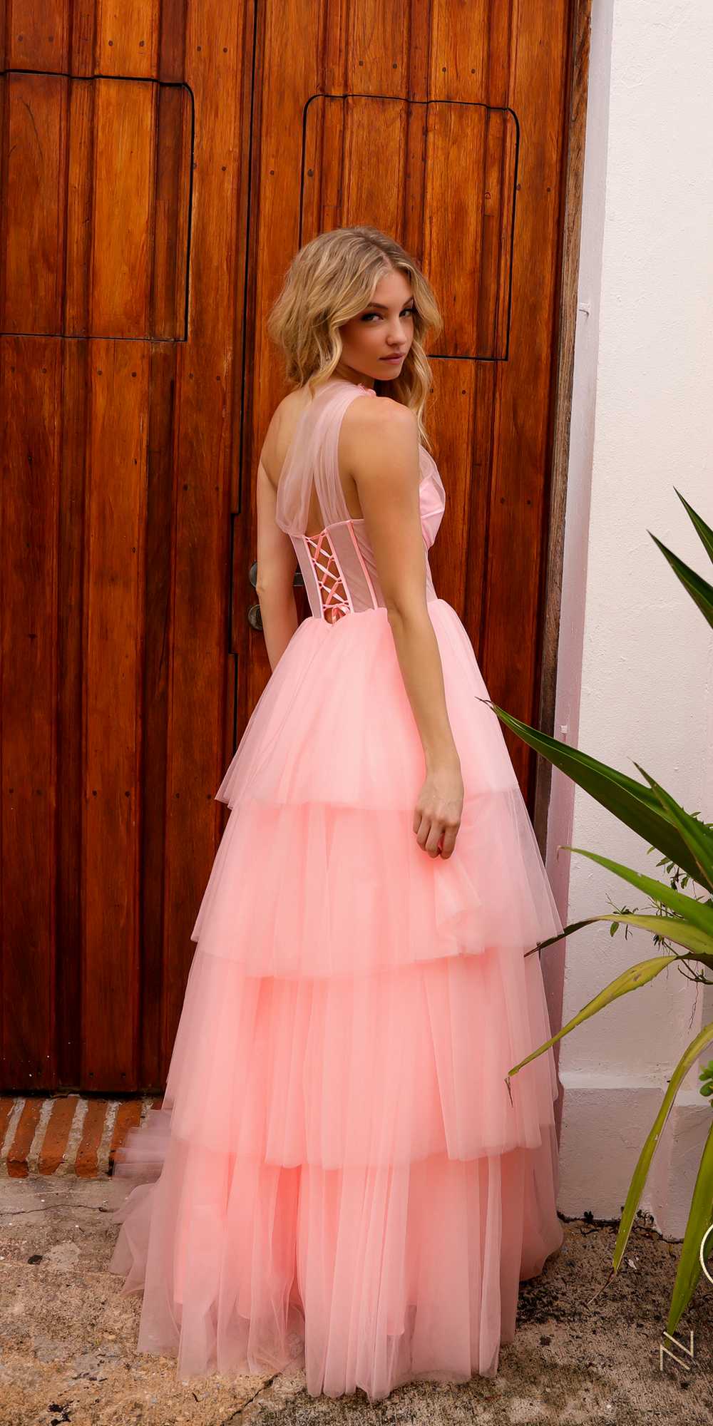 Pink tiered tulle A-line ball gown with corset-style bodice and layered ruffle skirt