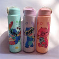 Three pastel character drink tumblers with flip-top lids: mint, purple, and coral.