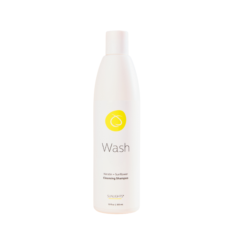 Sunlights Wash cleansing shampoo bottle, white pump top, yellow logo and Wash label