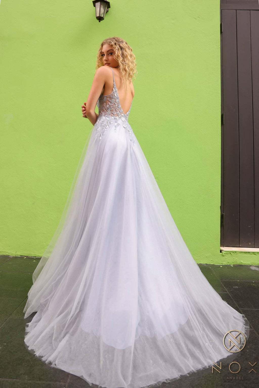 White sleeveless A-line tulle gown with sweetheart lace applique bodice, full skirt