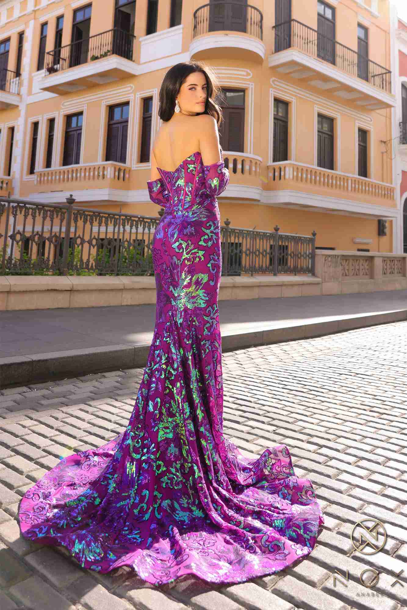 Purple fuchsia strapless sequin gown with floral embroidery and long matching sleeves
