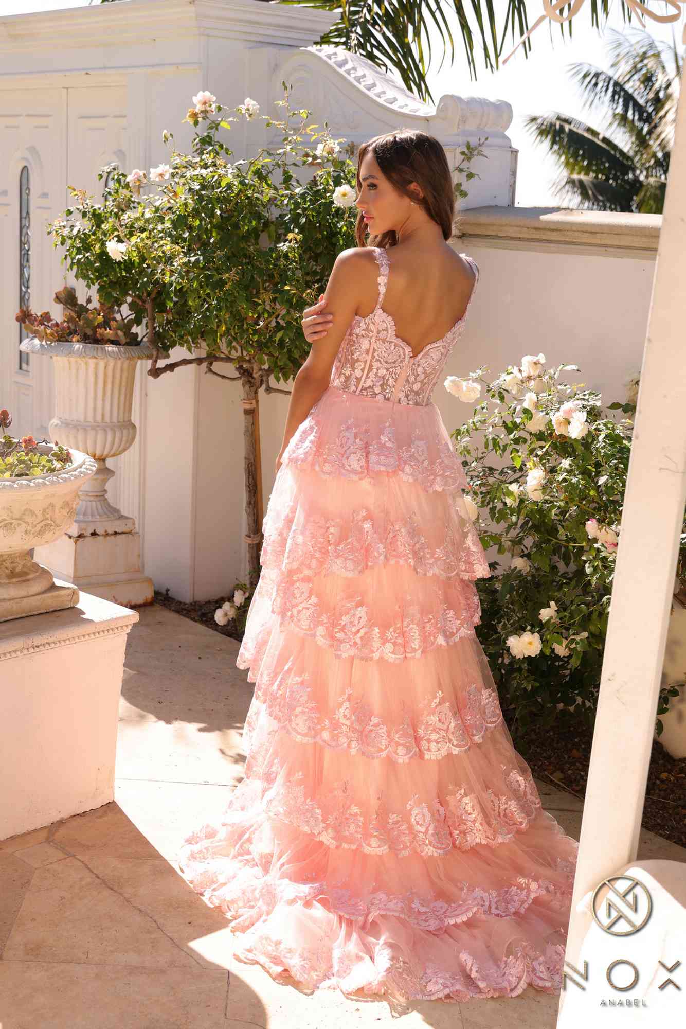 Long off-the-shoulder tiered A-line formal gown in blush pink, side view