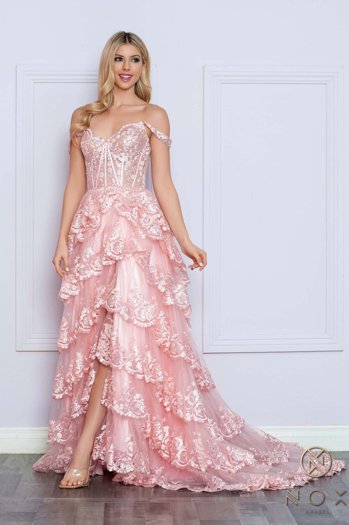 Long off-the-shoulder tiered A-line formal gown in blush pink, full length