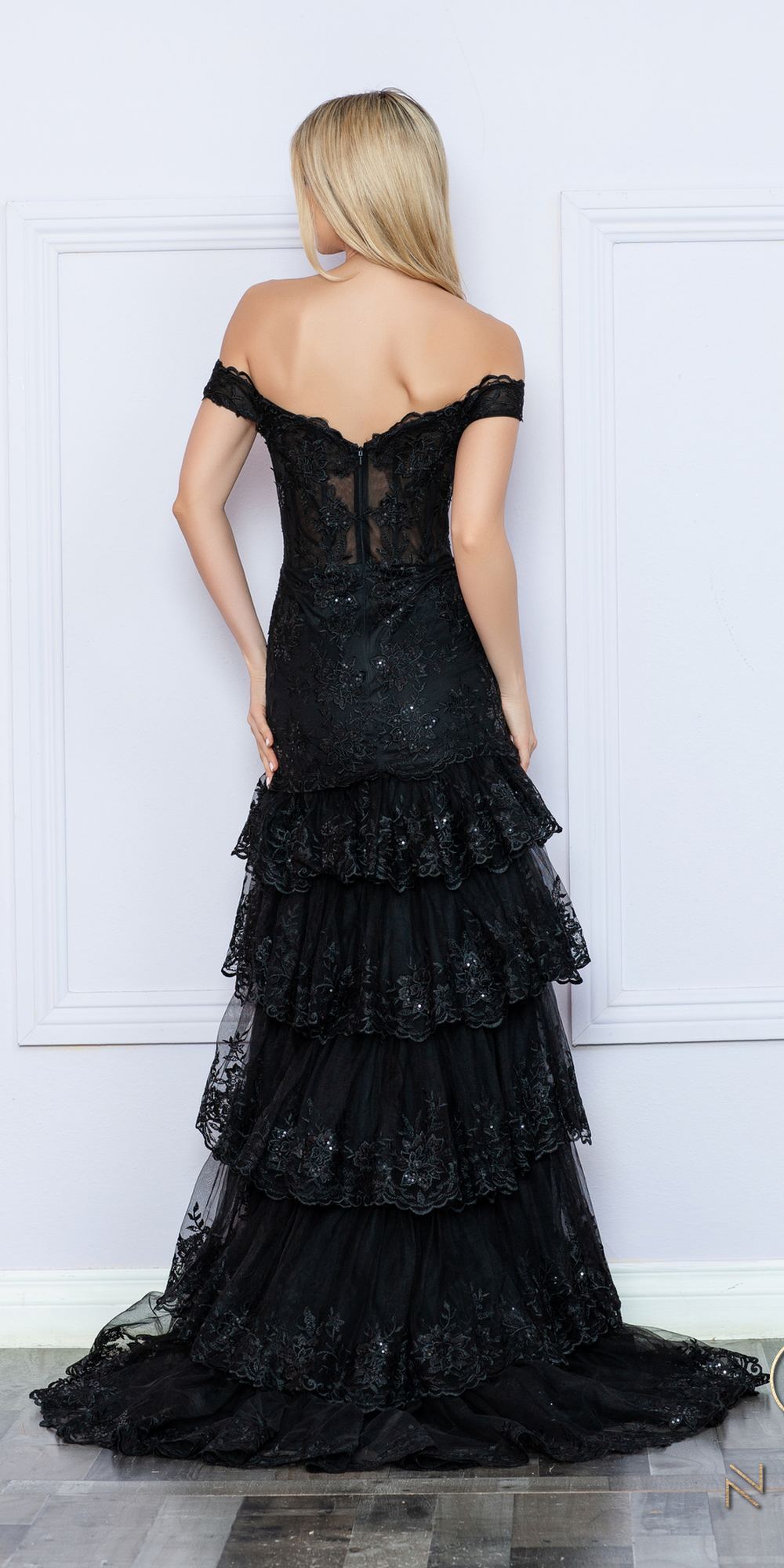 Black off-shoulder corset dress with open back and layered tiered ruffle skirt