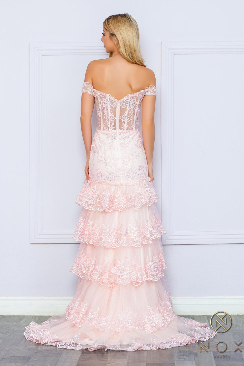 Blush off-shoulder corset-style dress with layered tiered ruffles, long length.