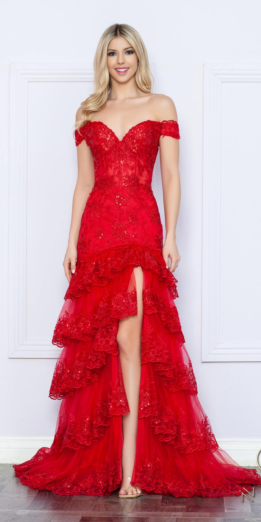 Red off-shoulder corset dress with layered ruffle skirt and front leg slit.