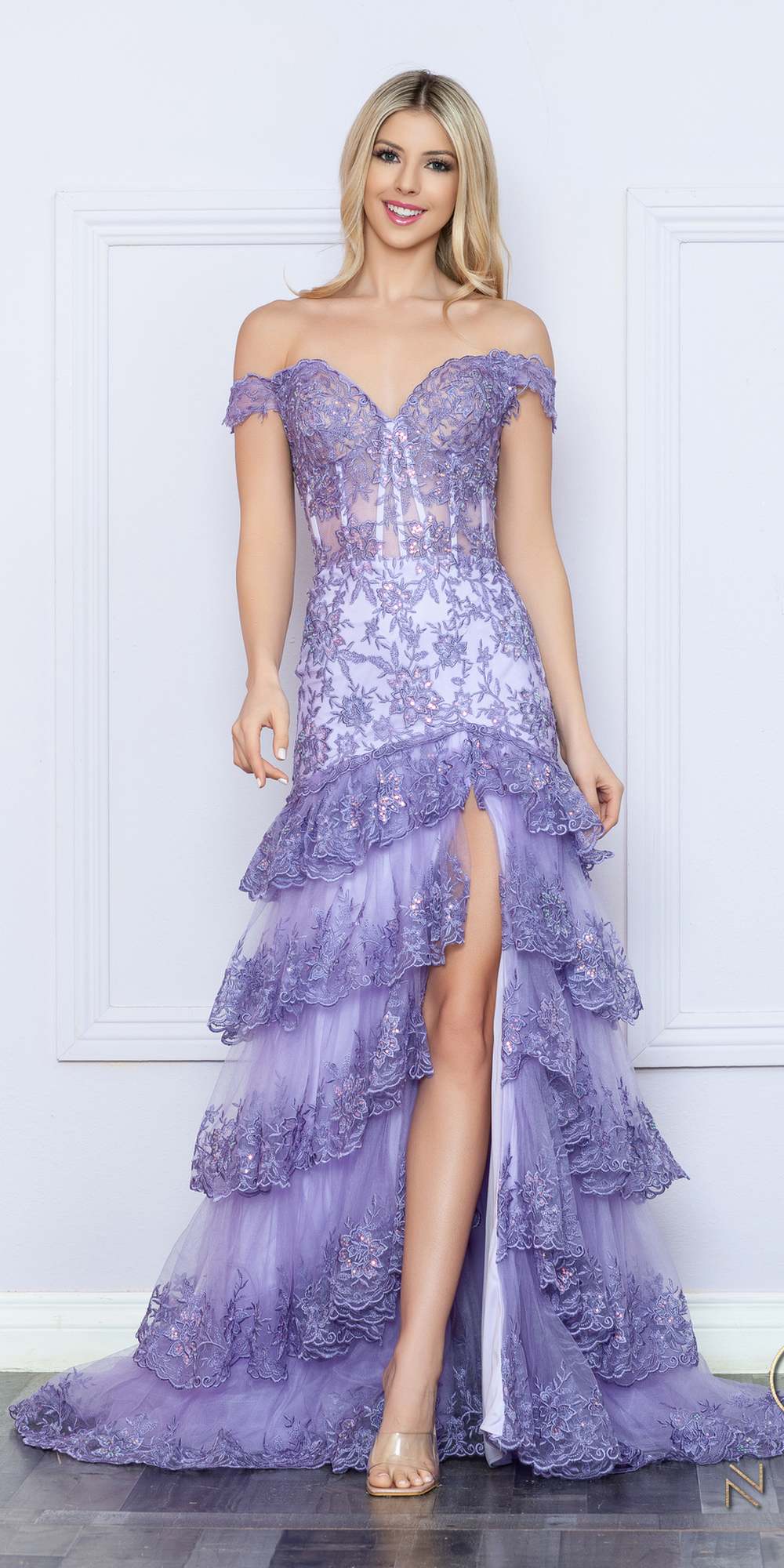 Lilac off-shoulder corset dress with tiered ruffles and thigh slit, standing front view