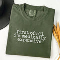 Olive green graphic tee with white slogan text across the chest