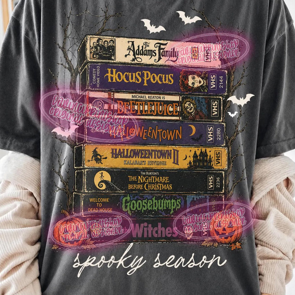 Black spooky season graphic tee with colorful movie poster collage and bats