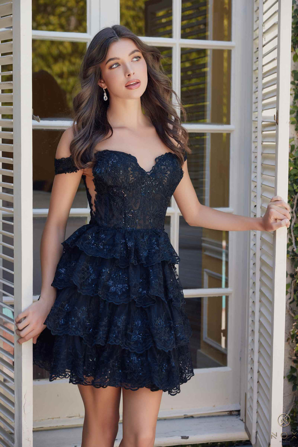 Black off-shoulder lace tiered mini dress with textured bodice and fluttering ruffle tiers