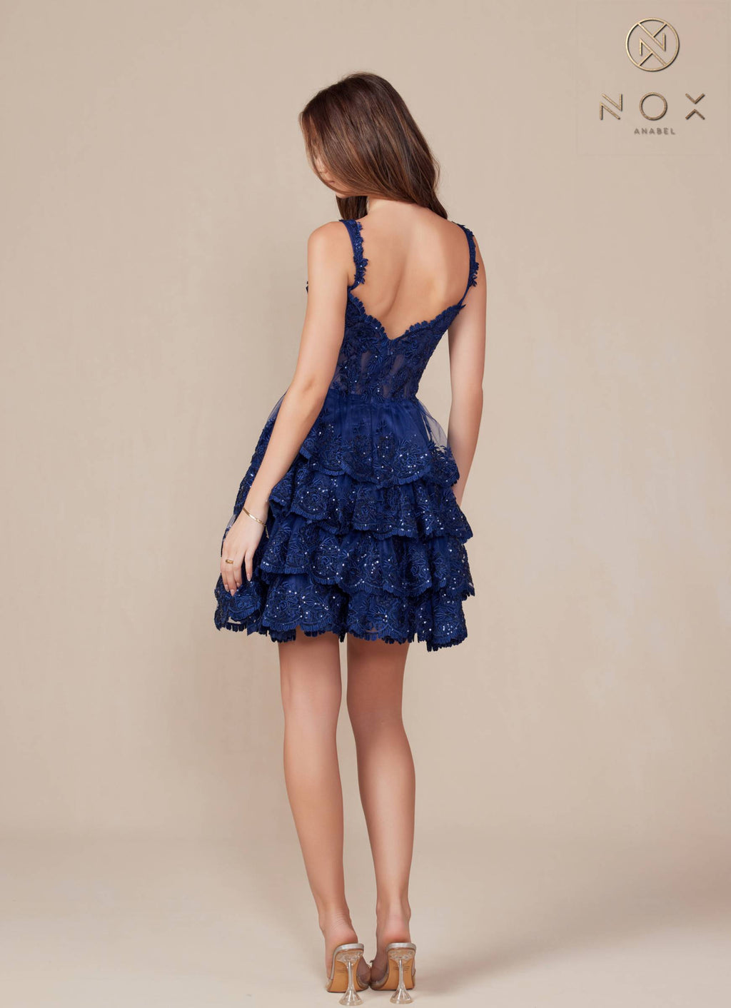 Navy blue sleeveless backless A-line tiered dress with lace-style embroidery and ruffles