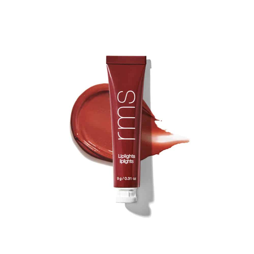 Brick-orange cream lip gloss tube with glossy swatch