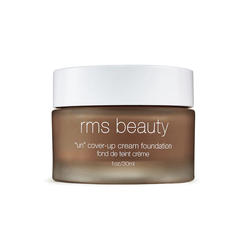 Cream foundation jar with white cap, dark beige cream product inside