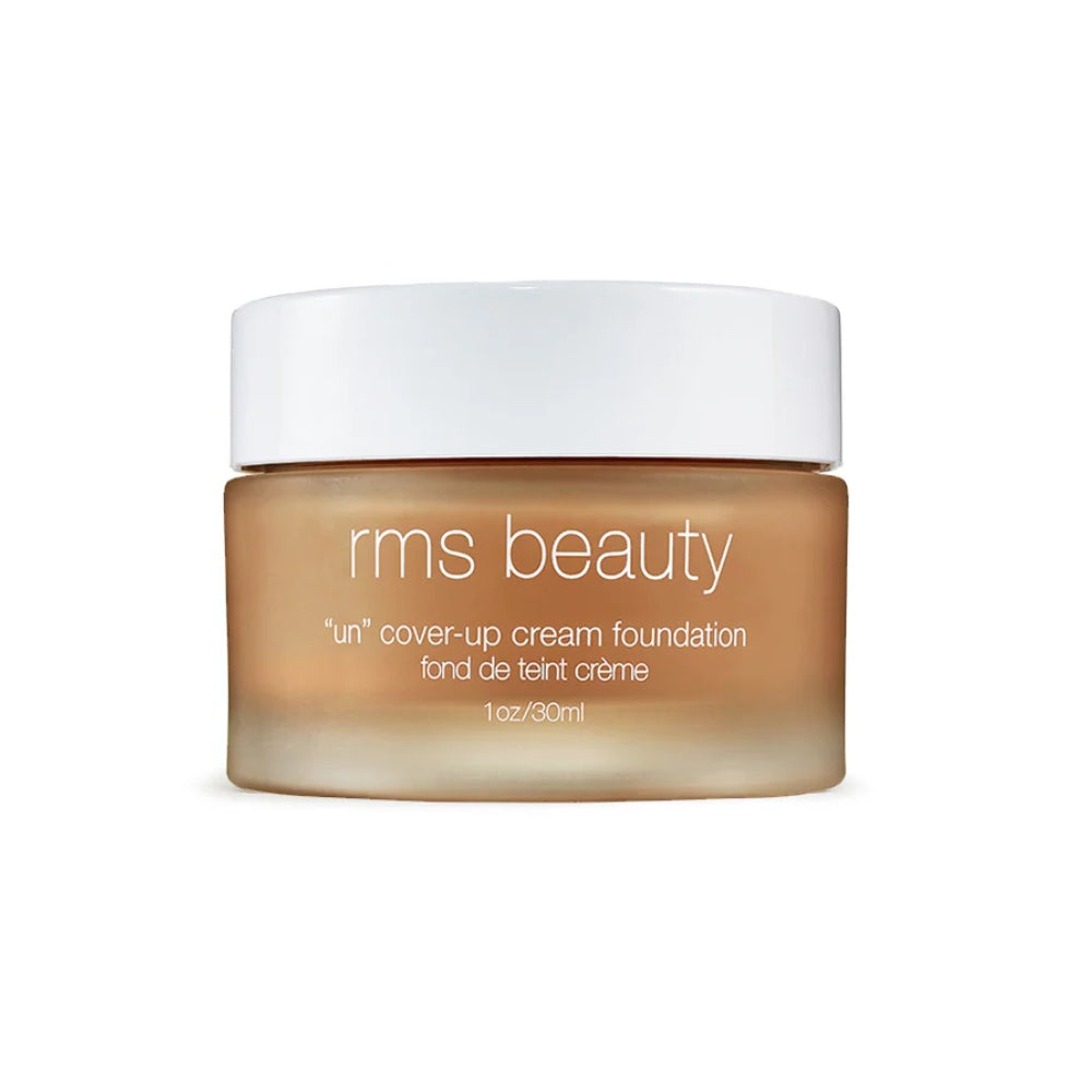 Cream foundation jar with white cap, light beige cream product inside