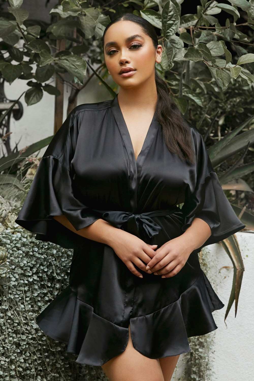 Black satin kimono robe with V-neck, tie waist, wide flutter sleeves, layered skirt