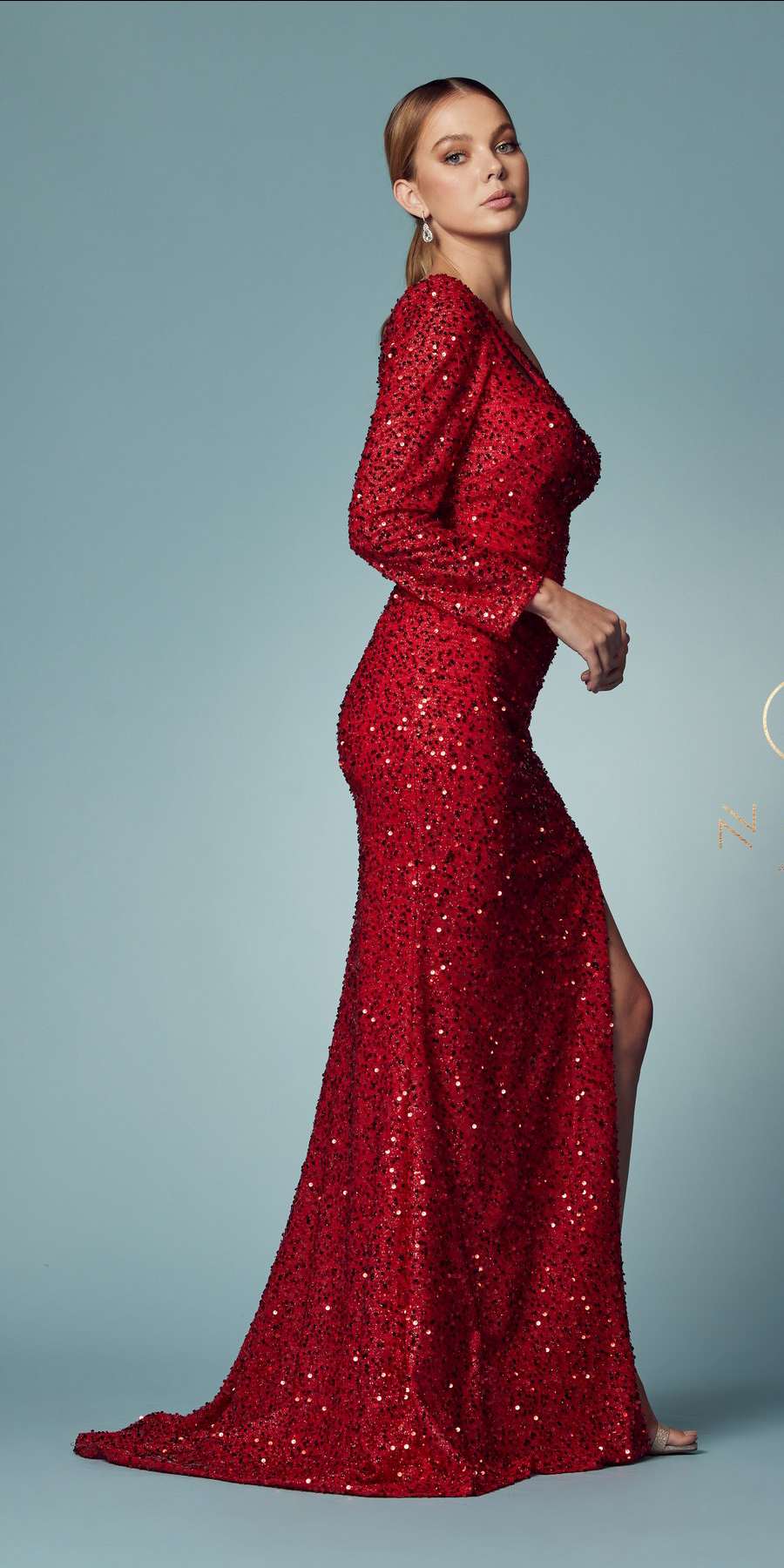Red one-sleeve sequined fitted gown with thigh-high slit and draped shoulder strap