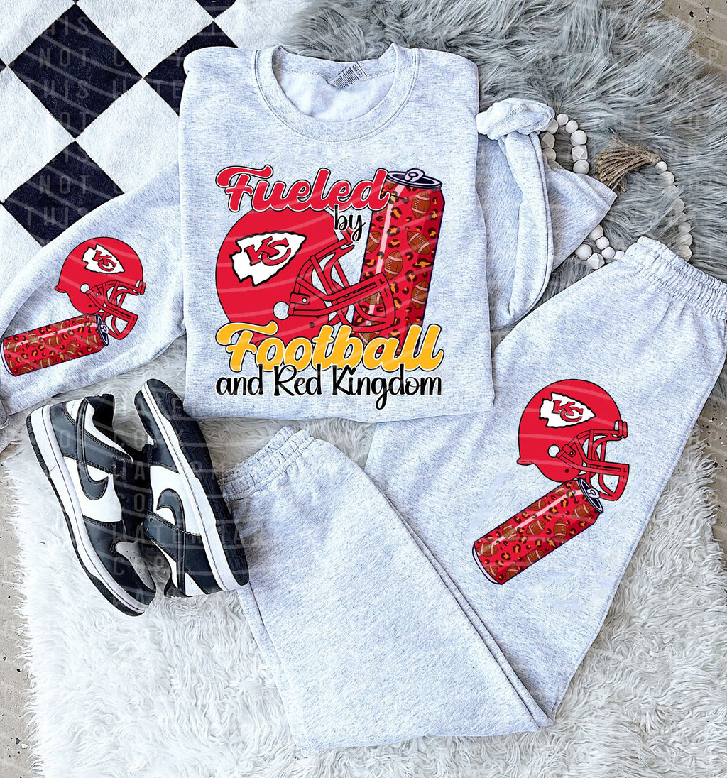Light gray crewneck graphic tee with red football helmet reading 'Fueled by Football and Red Kingdom'