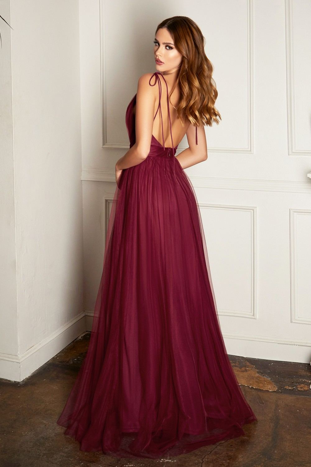 Burgundy plunging V-neck evening dress with thin straps and flowing sheer tulle skirt