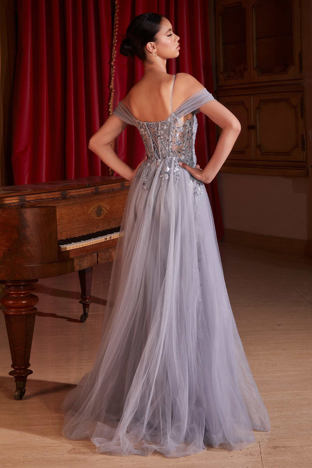 Silver off-shoulder fitted gown with open-back straps and flowing tulle long skirt