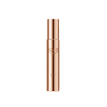 SK-II LXP serum bottle in rose gold cylinder with top cap