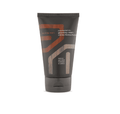 Aveda men grooming cream tube, dark gray with orange graphic and flip-cap base