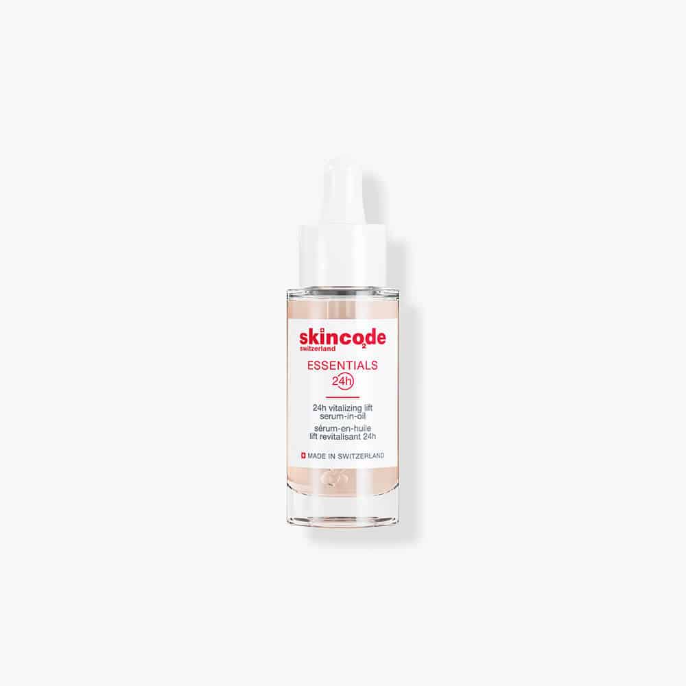 Skincode Essentials 24h serum-in-oil bottle with pump, clear glass and white label