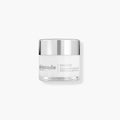 Skincode anti-aging cream jar with silver cap, clear glass and white label