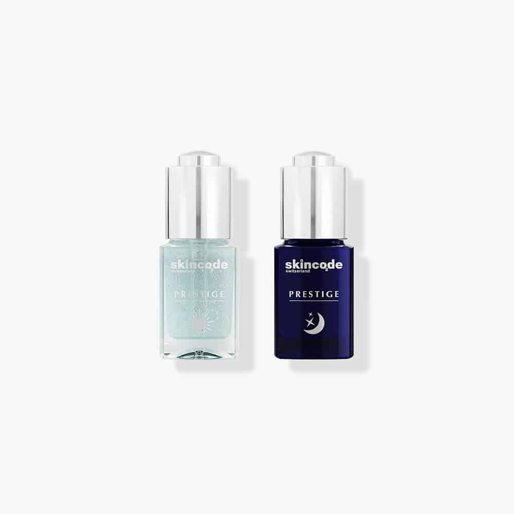 Skincode ampoule treatment set with two serum bottles, one light aqua and one dark blue