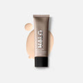 Tinted moisturizer tube with pale beige swatch and black base