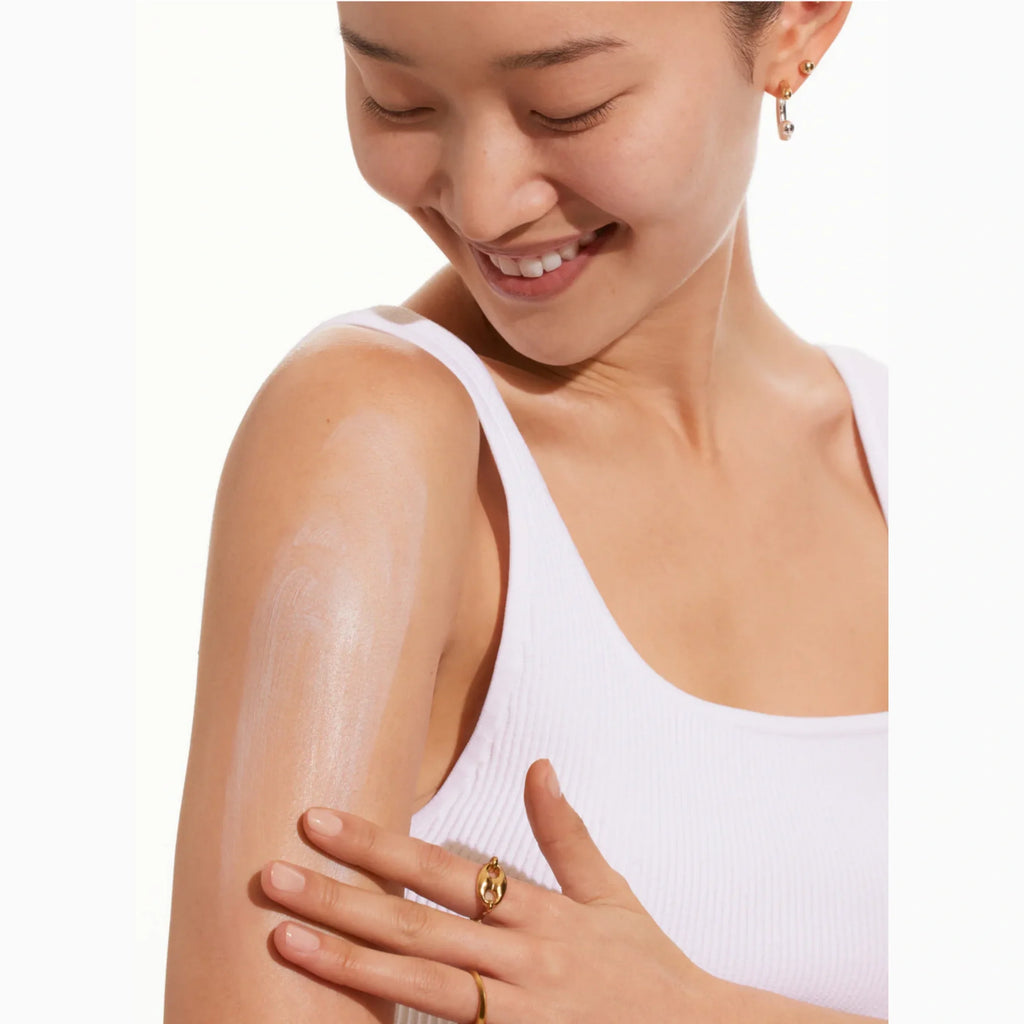 Supergoop! Play mineral SPF 30 lotion on a person’s shoulder, being smoothed