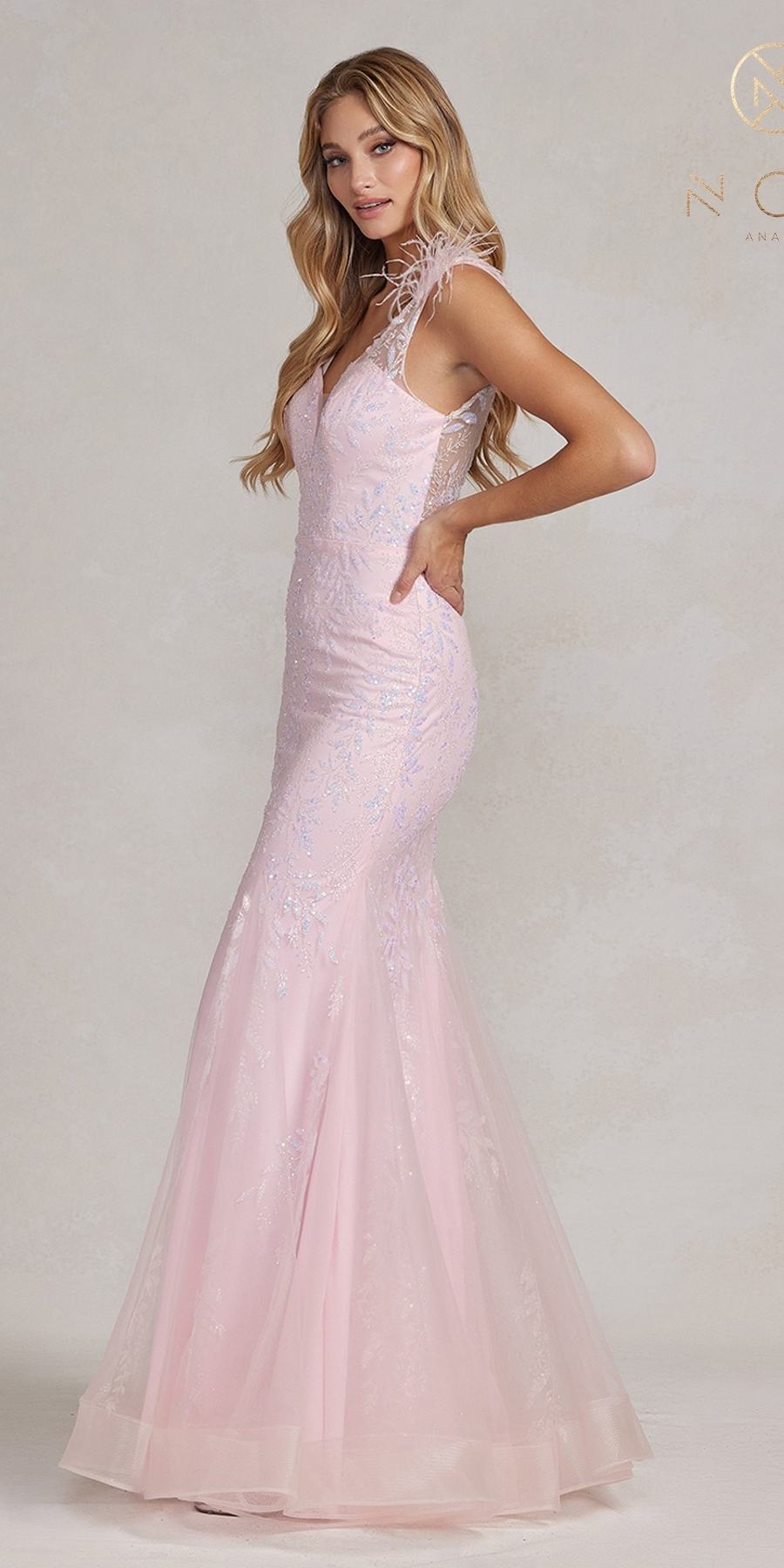 Pink long mermaid gown with feather straps and flowing tulle skirt hem