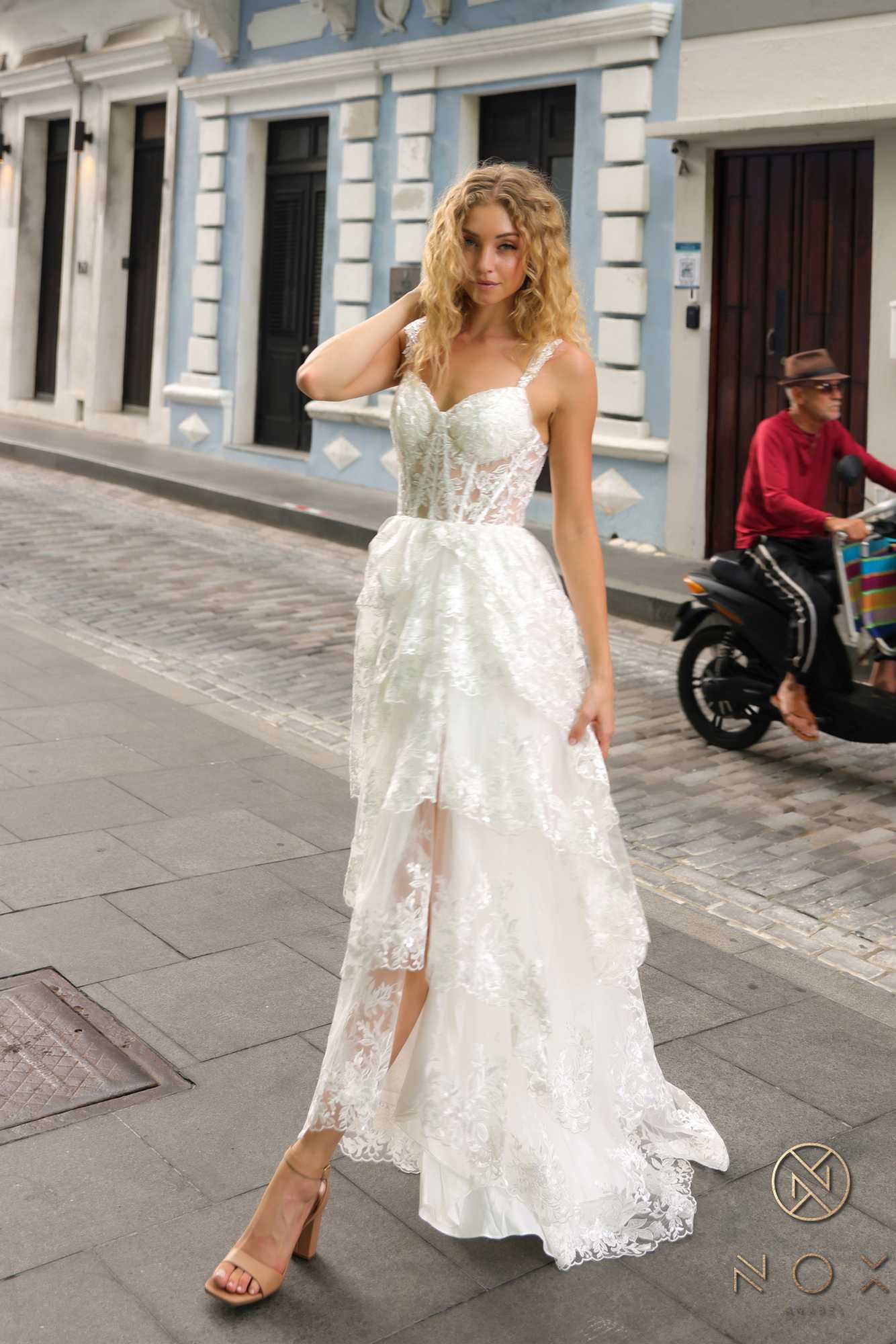 White lace tiered A-line dress with thin straps and front slit