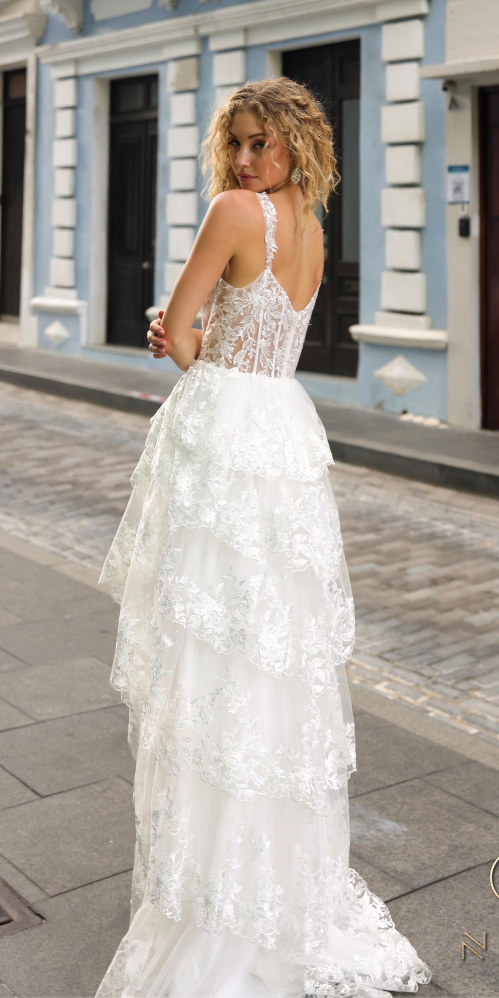 White lace tiered A-line dress with thin straps and open-back detail