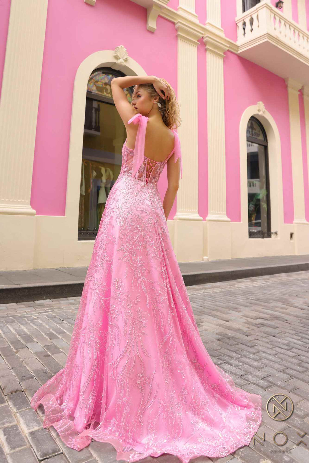 Pink long A-line glitter sequin corset ball gown with appliqué sparkle, bow straps