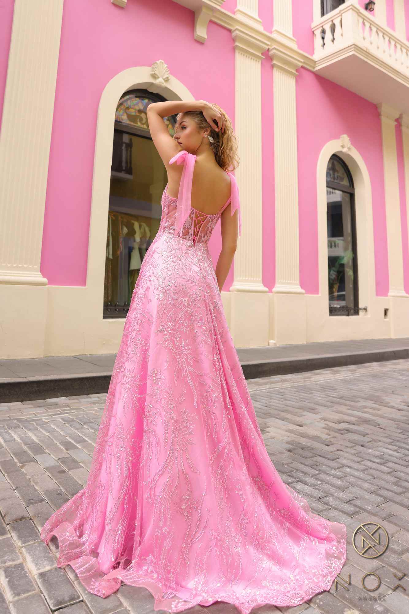 Pink long A-line glitter sequin corset ball gown with appliqué sparkle, bow straps