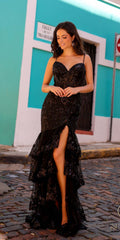 Black sequin mermaid gown with corset-style bodice, lace trim, and front slit