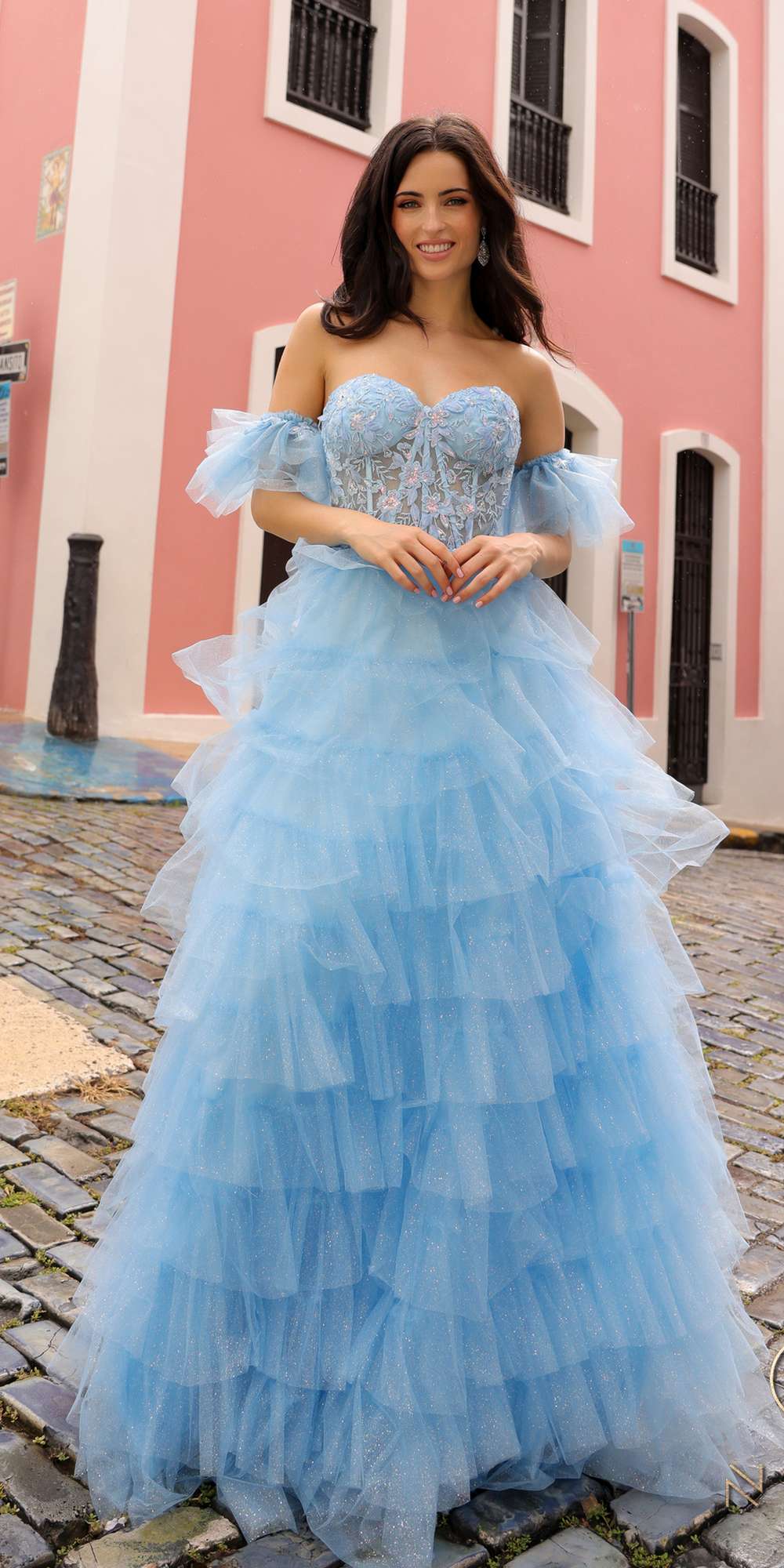 Light blue long tiered A-line ball gown with ruffled off-shoulder bodice and arm cuffs