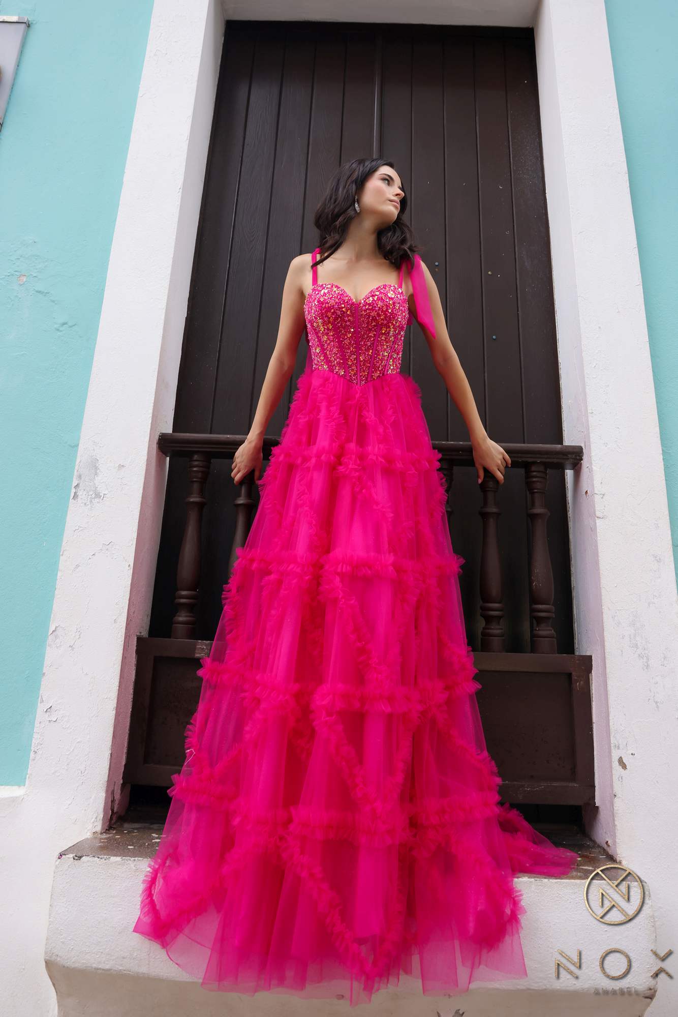 Fuchsia pink long A-line gown with tiered ruffle tulle skirt and corset-style bodice