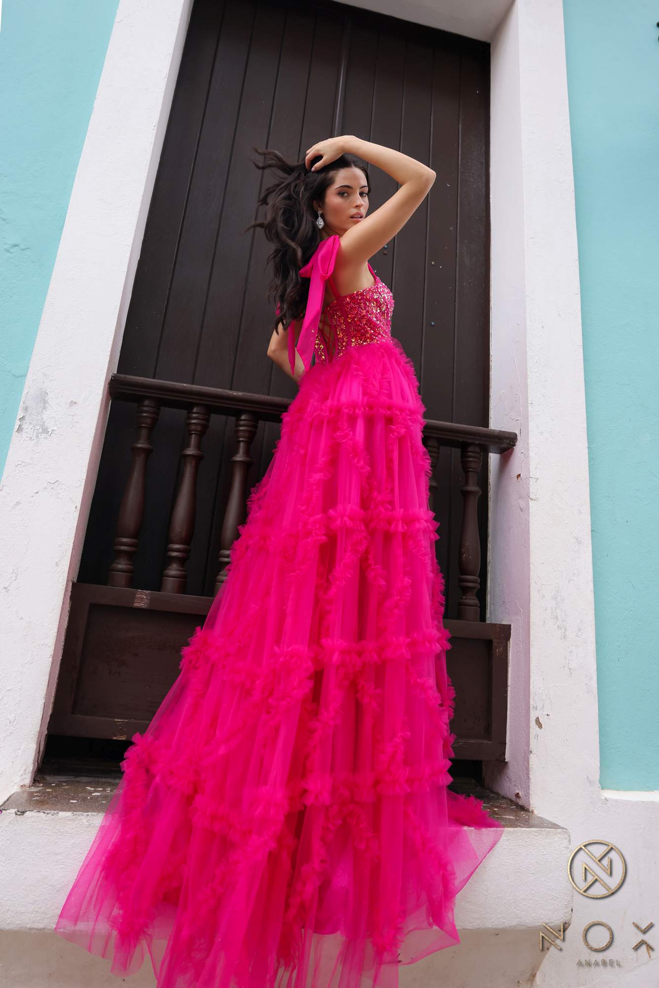 Fuchsia ruffled tulle A-line gown with boned bustier and ribbon spaghetti straps