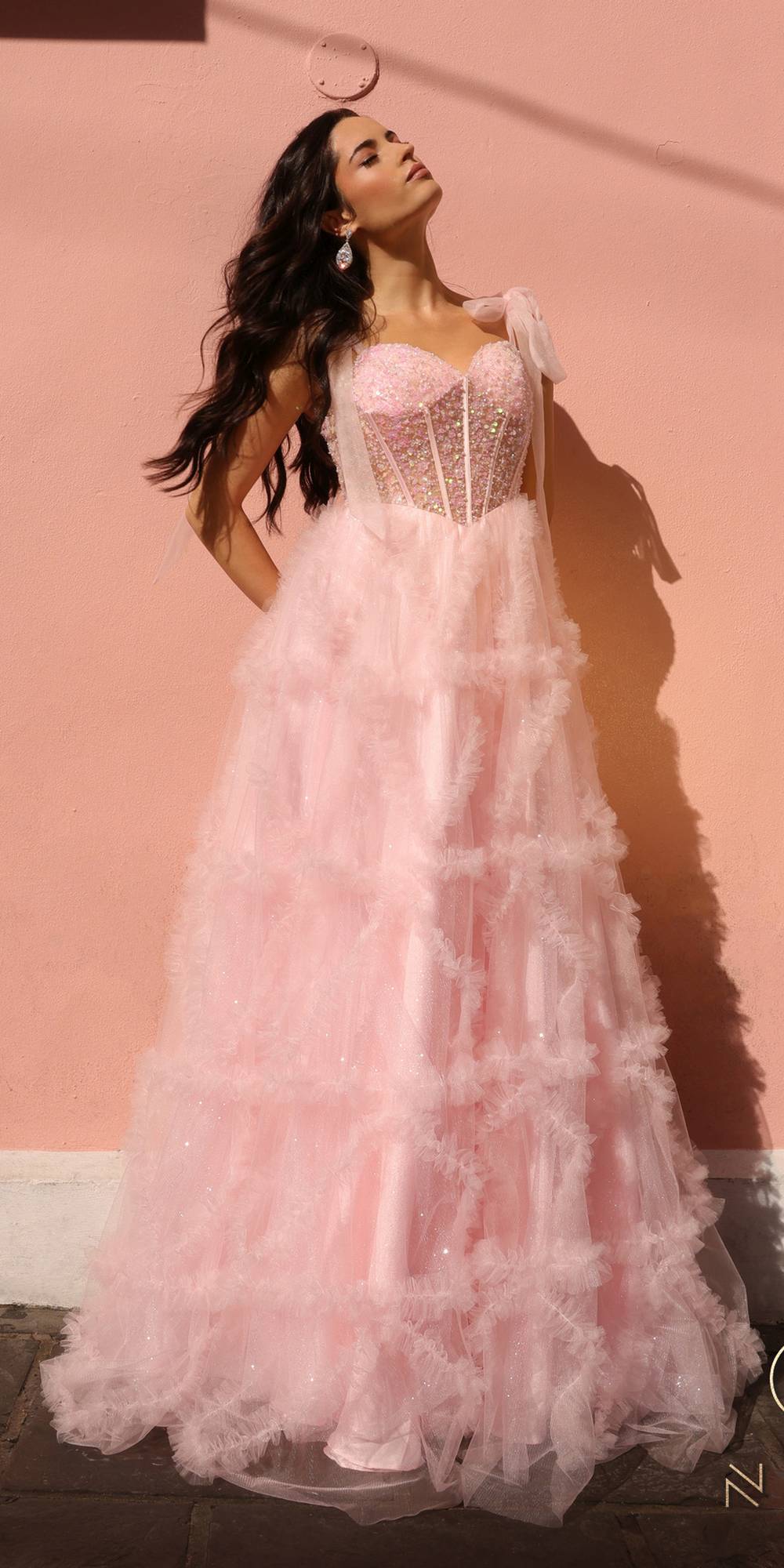 Blush pink corset bodice gown with embellished bust and long tiered ruffle skirt
