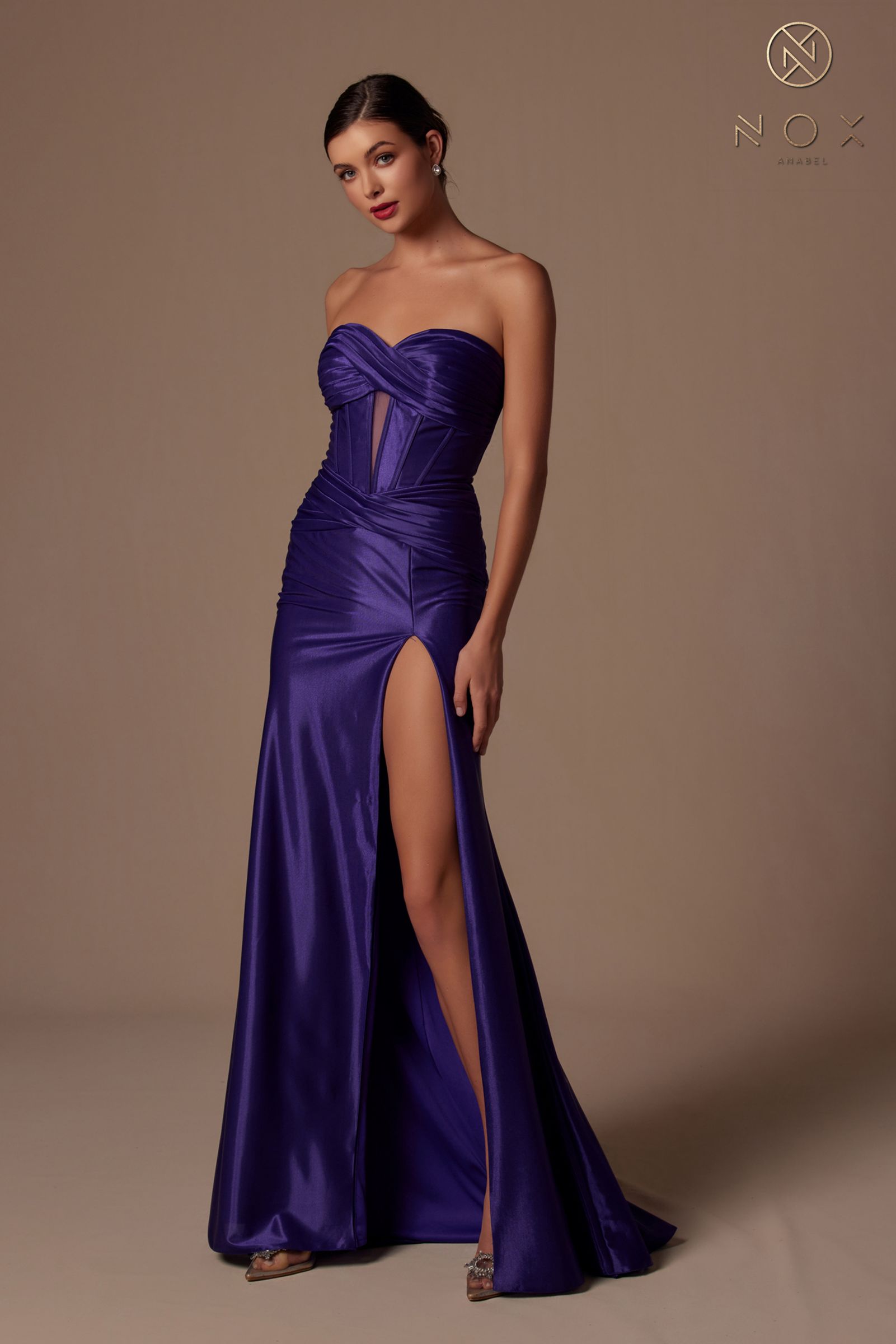 Strapless deep purple evening gown with sweetheart neckline, ruched bodice and thigh slit.