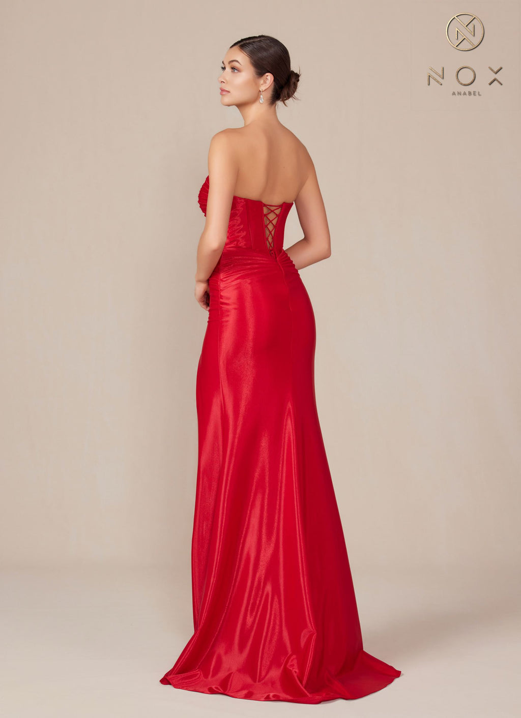 Back view of strapless red evening gown with sweetheart neckline, fitted silhouette.