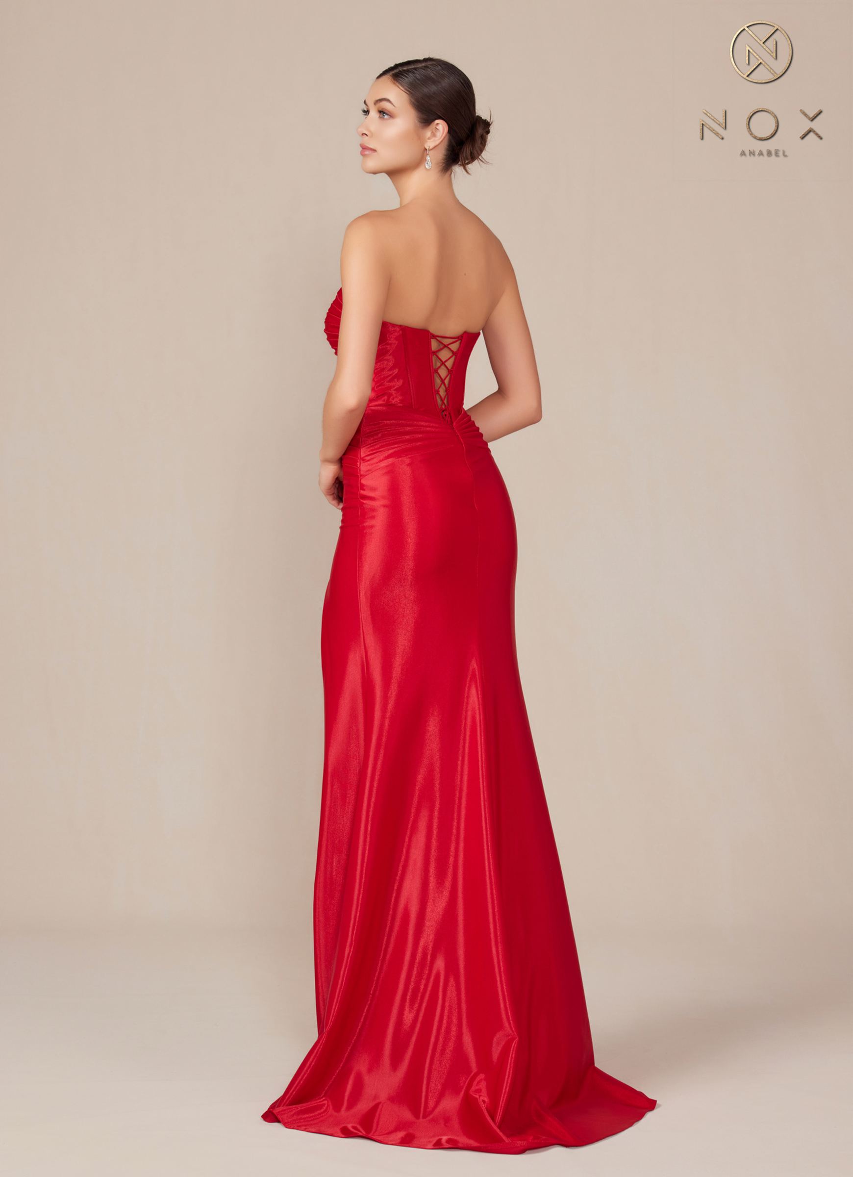 Back view of strapless red evening gown with sweetheart neckline, fitted silhouette.